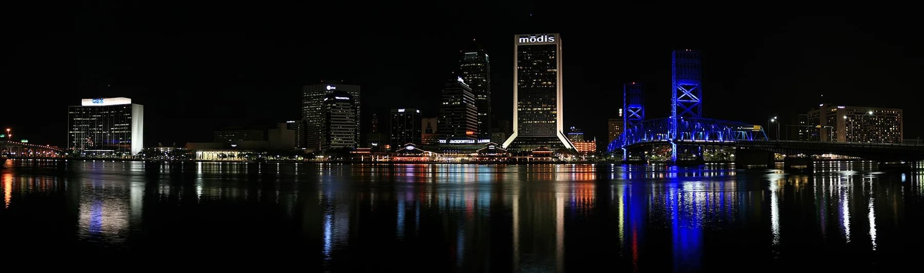 Jacksonville skyline and bridge lights reflected in the St. Johns River at night