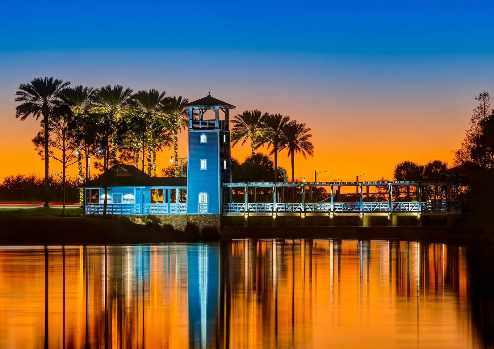 Sunset reflected in Lake Tradition beside its waterfront pavilion in Port St. Lucie