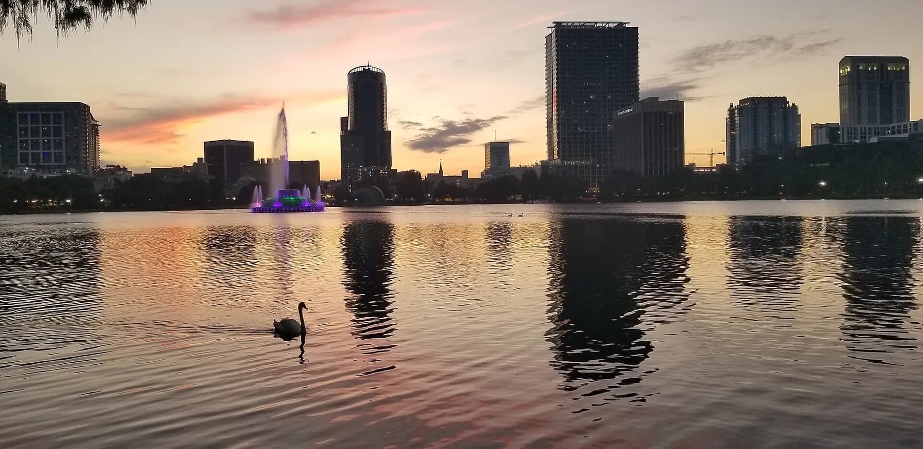 Sunset over Lake Eola, its fountain and the Orlando skyline